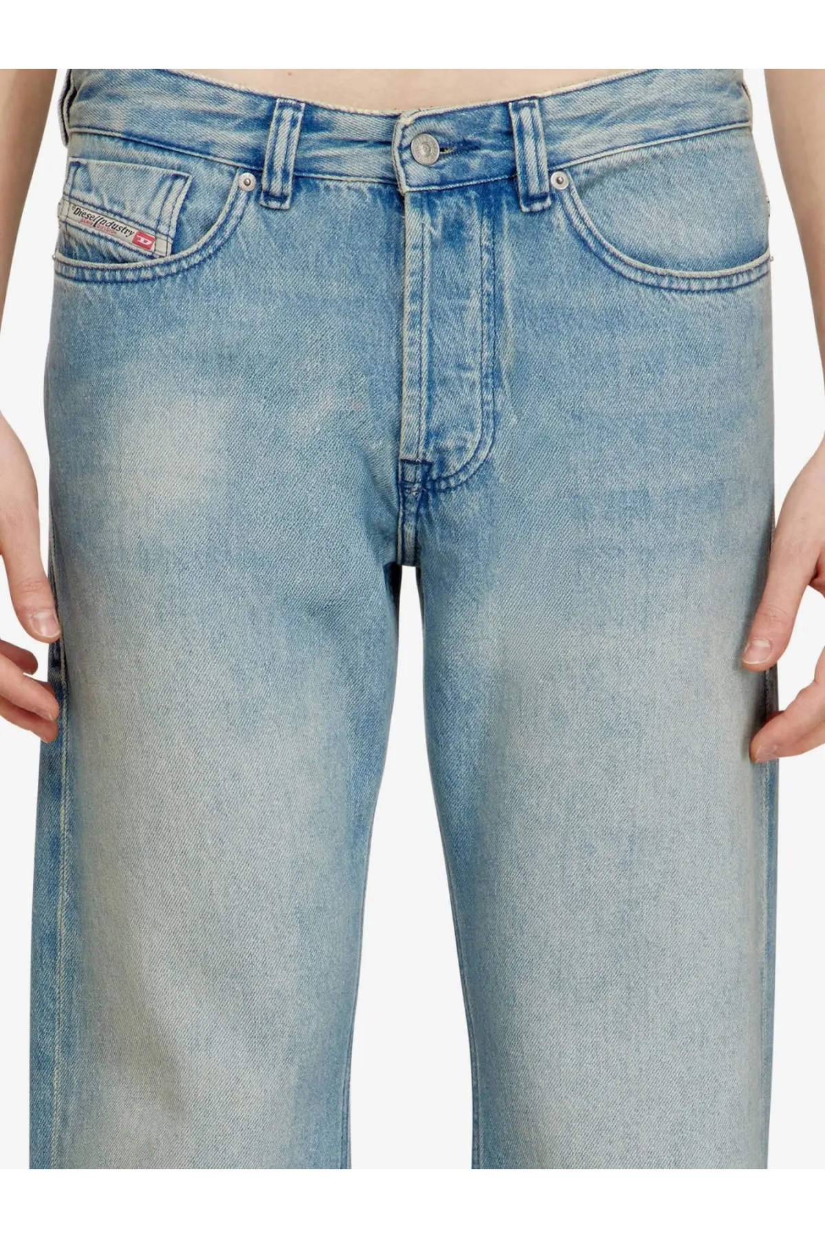 Back side of light-wash faded diesel men’s eeper blue denim jeans showing the brand label on the pocket