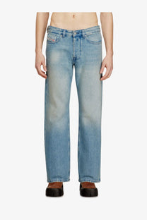 Back side of diesel men’s Eeper blue light-wash denim jeans with straight-leg cut and subtle fading showing brand logo