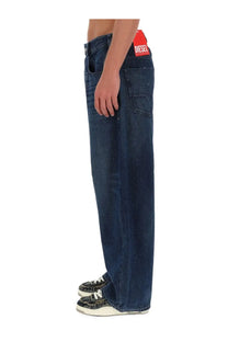 Dark blue denim jeans with a red diesel brand label at the waistband for men