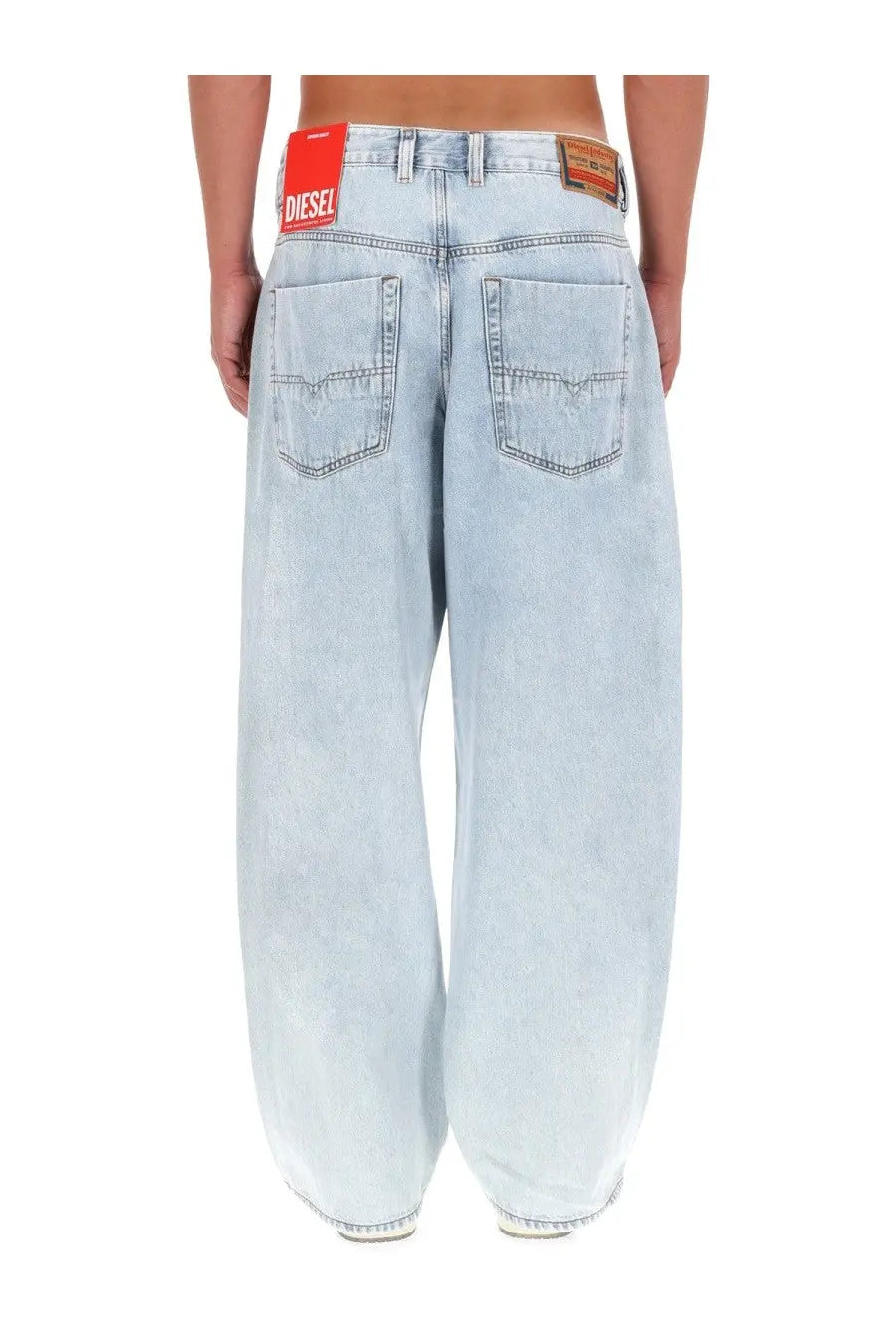 Back view of light-wash diesel men’s denim jeans with wide-leg cut and red diesel branding on waistband