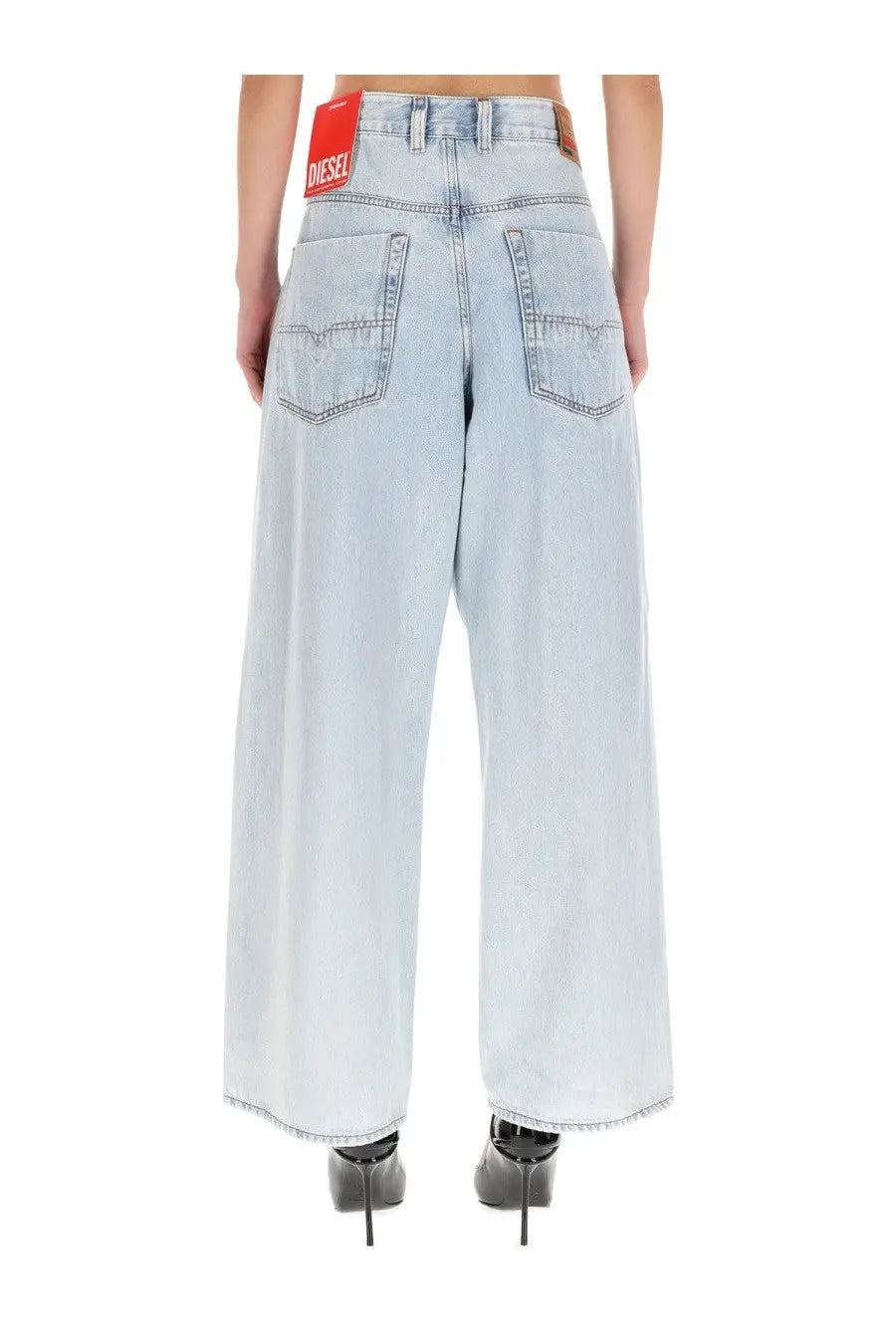 Light-wash denim wide-leg jeans with red Diesel brand label at waistband in Diesel men’s Enim Jeans blue collection