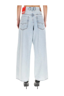 Light-wash denim wide-leg jeans with red Diesel brand label at waistband in Diesel men’s Enim Jeans blue collection