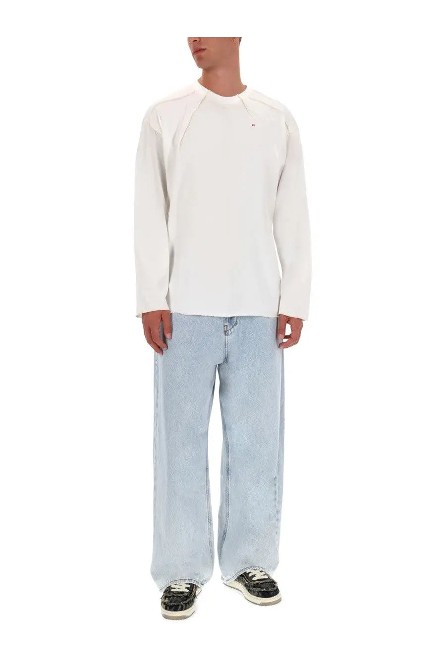 White long-sleeved crewneck sweatshirt with subtle seams and small logo paired with diesel men’s enim jeans blue