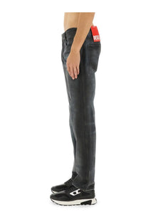 Dark-wash denim jeans for men by diesel with a red brand tag at the waistband in blue color