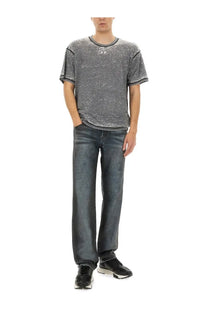 Diesel men’s jeans blue with a gray textured short-sleeve t-shirt featuring a subtle white logo on the chest