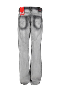 Diesel men’s gray distressed denim jeans with faded wash and visible brand label at the waistband