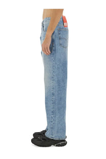 Diesel men’s jeans macro blue light-wash denim with straight-leg cut and red diesel brand tag at waistband