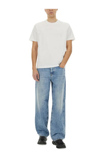 White cotton t-shirt with subtle embossed logo on chest paired with diesel men’s jeans macro blue product image