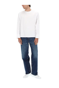 White long-sleeved crewneck cotton top paired with diesel men’s jeans macro blue dark denim cotton blend