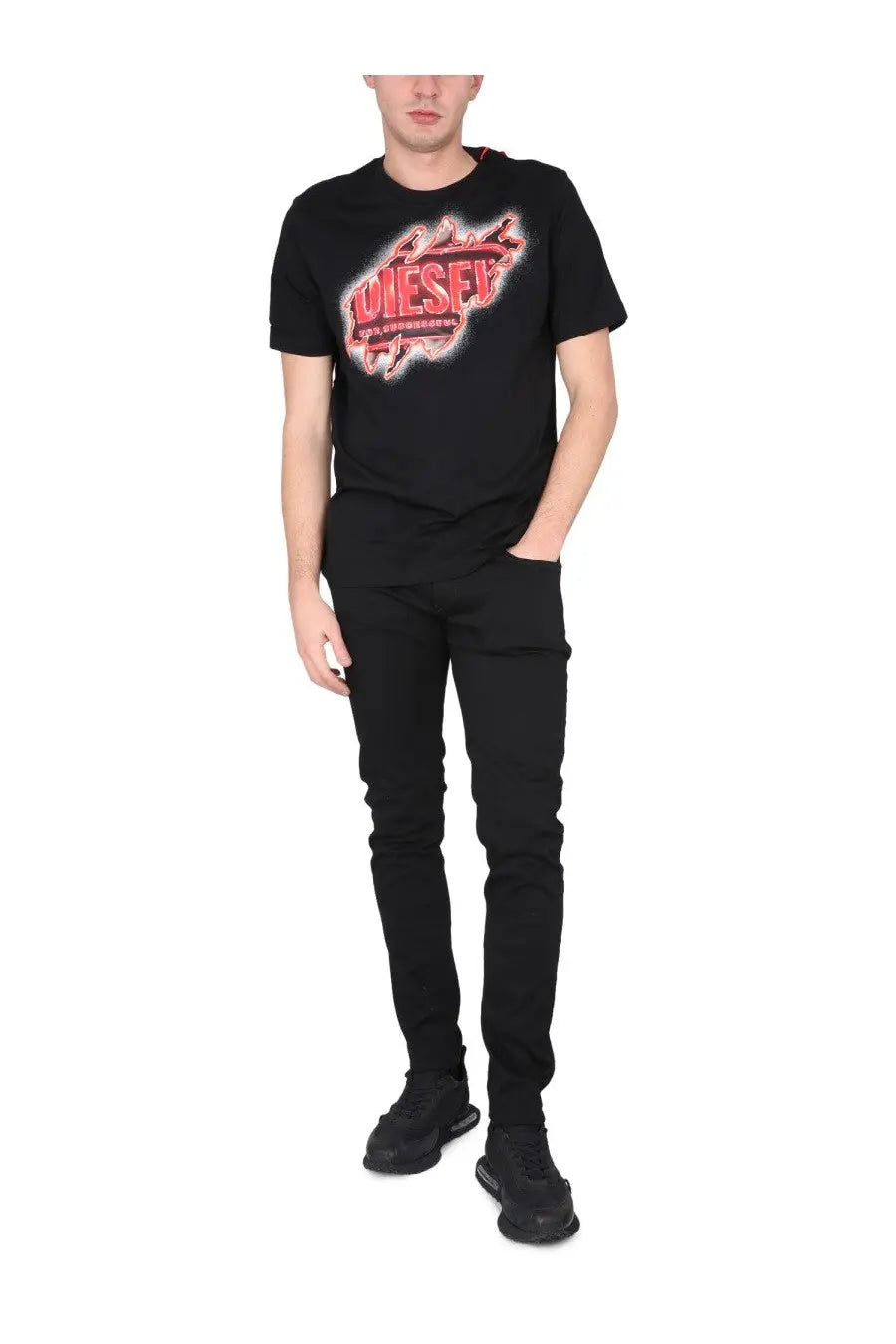 Black diesel t shirt with bold red and white distressed graphic logo from diesel men’s jeans strukt black collection