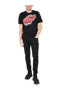 Black diesel t shirt with bold red and white distressed graphic logo from diesel men’s jeans strukt black collection