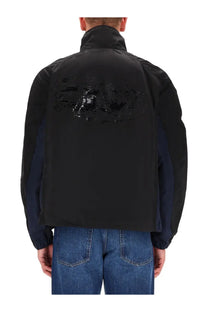 Back view of diesel men’s kaye black two-tone bomber jacket with glossy abstract graphic on navy blue back panel