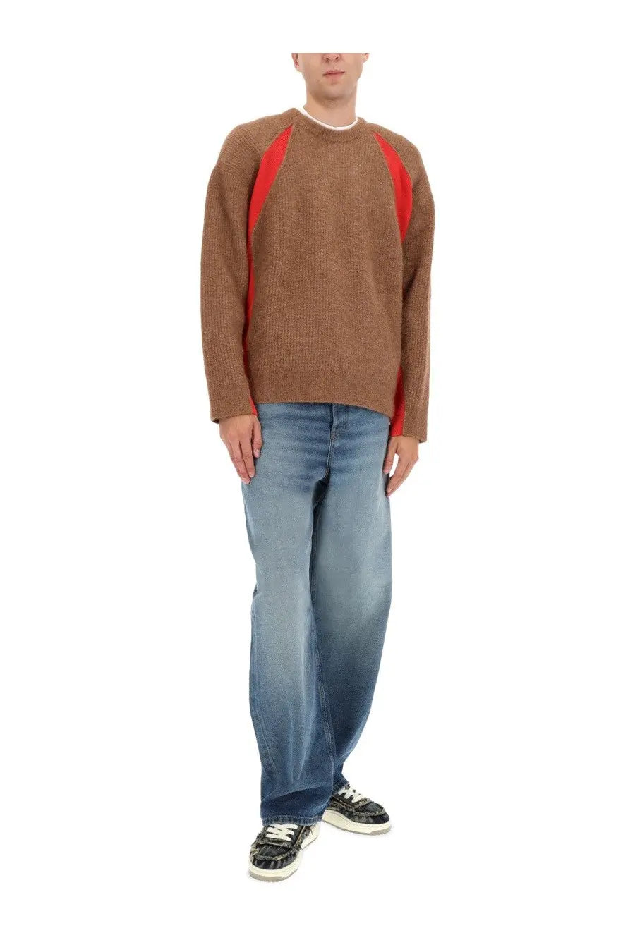 Brown knit sweater with bold red diagonal panels on the shoulders paired with diesel men’s macro jeans blue
