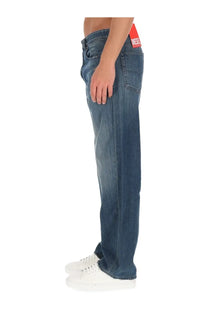 Back side of diesel men’s macro blue denim jeans with red diesel brand label on the waistband