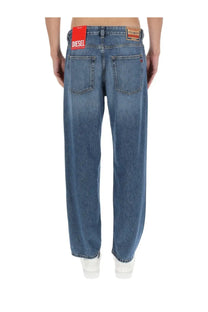 Blue denim relaxed fit jeans for men with red diesel brand label on waistband Diesel men’s Macs jeans blue
