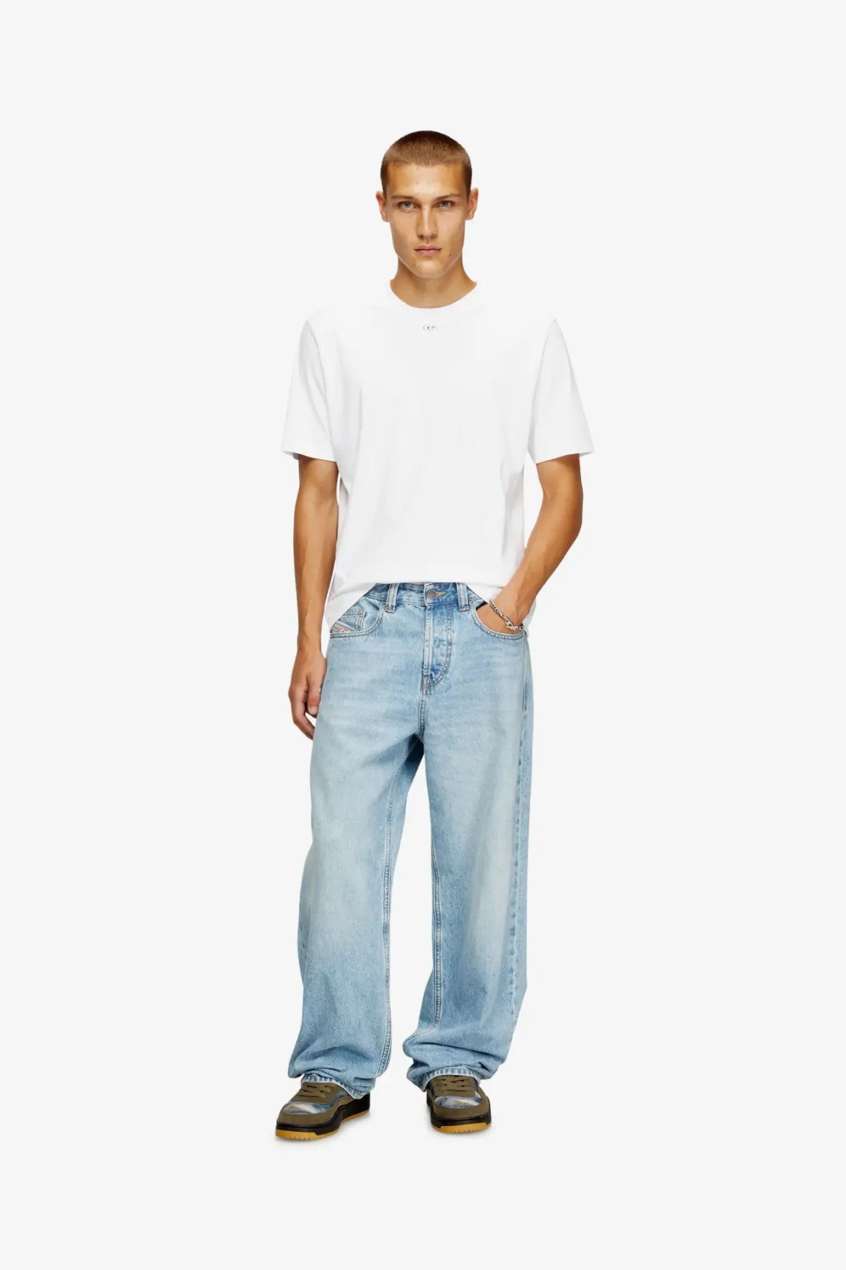 Light-wash denim jeans with a relaxed wide-leg cut paired with a Diesel men’s Madjust TR cotton shirt white