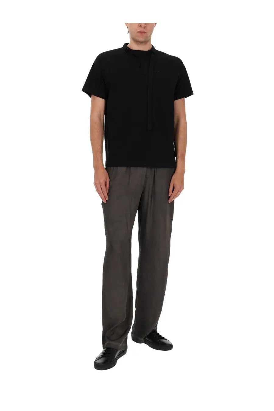 Diesel men’s black short-sleeved t-shirt with high neckline and vertical seam detail paired with grey pantalone