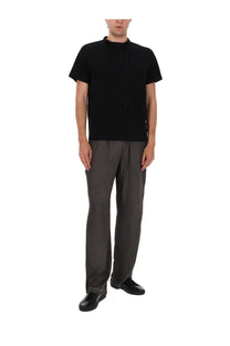 Diesel men’s black short-sleeved t-shirt with high neckline and vertical seam detail paired with grey pantalone