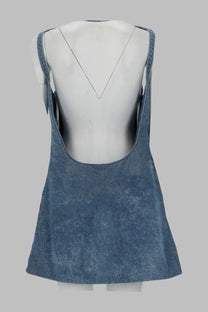 Denim blue slightly faded textured fabric dress with thin straps and deep back cutout shown from the back side