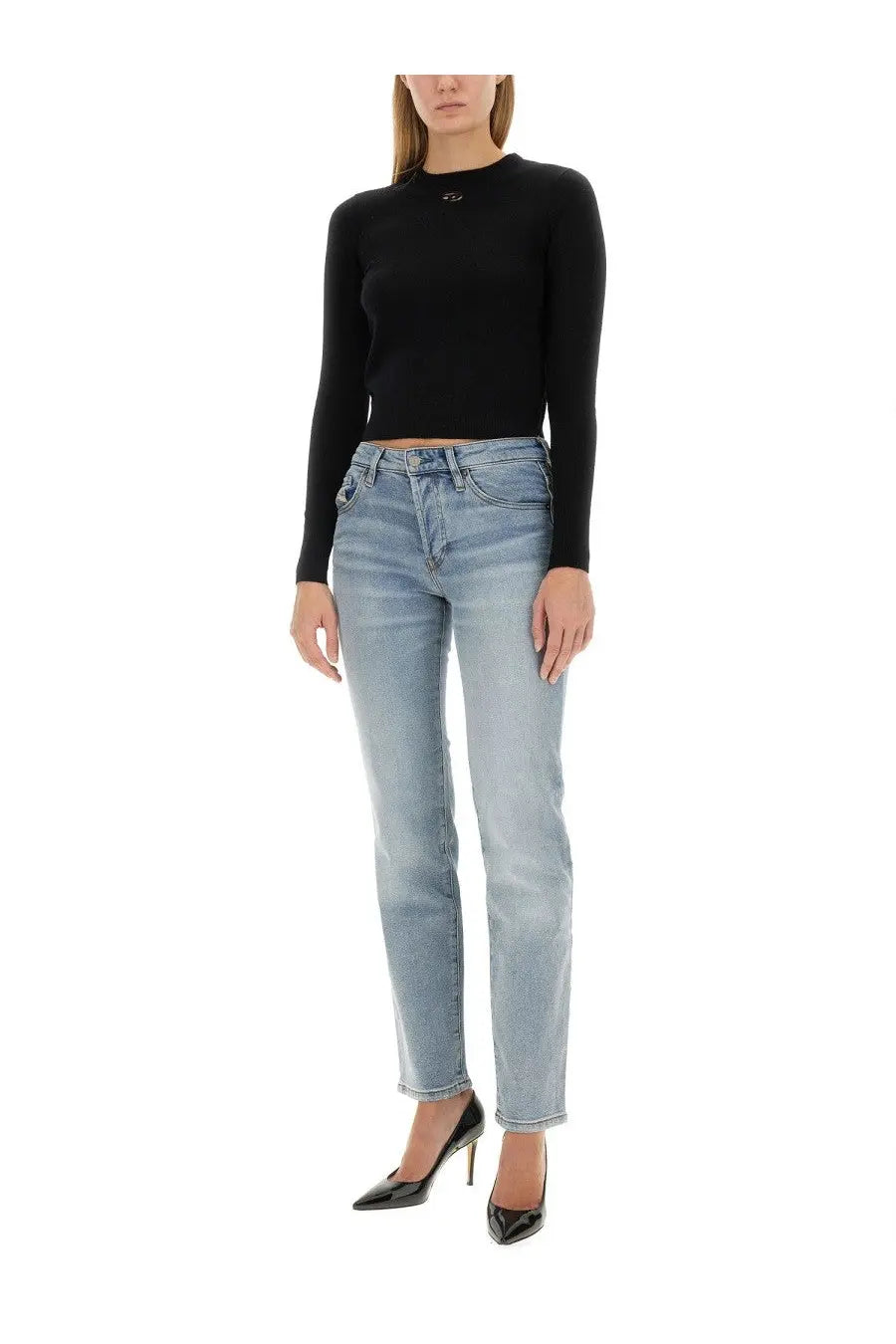 Light-wash denim jeans with straight-leg cut and classic five-pocket design paired with diesel women’s areesax black shirt