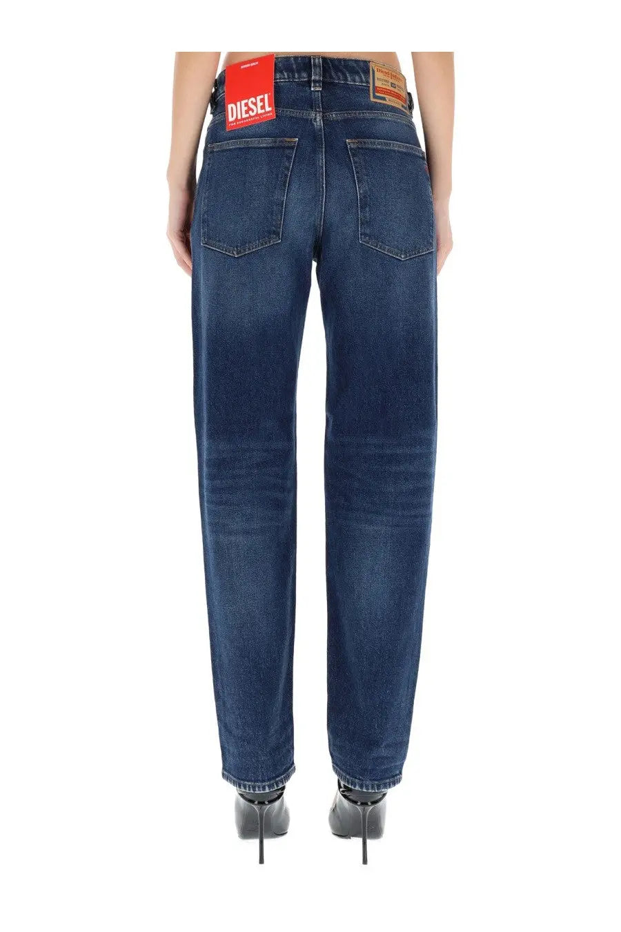Dark blue denim diesel women’s ark jeans with classic five-pocket design and red brand label at waistband