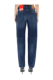 Dark blue denim diesel women’s ark jeans with classic five-pocket design and red brand label at waistband