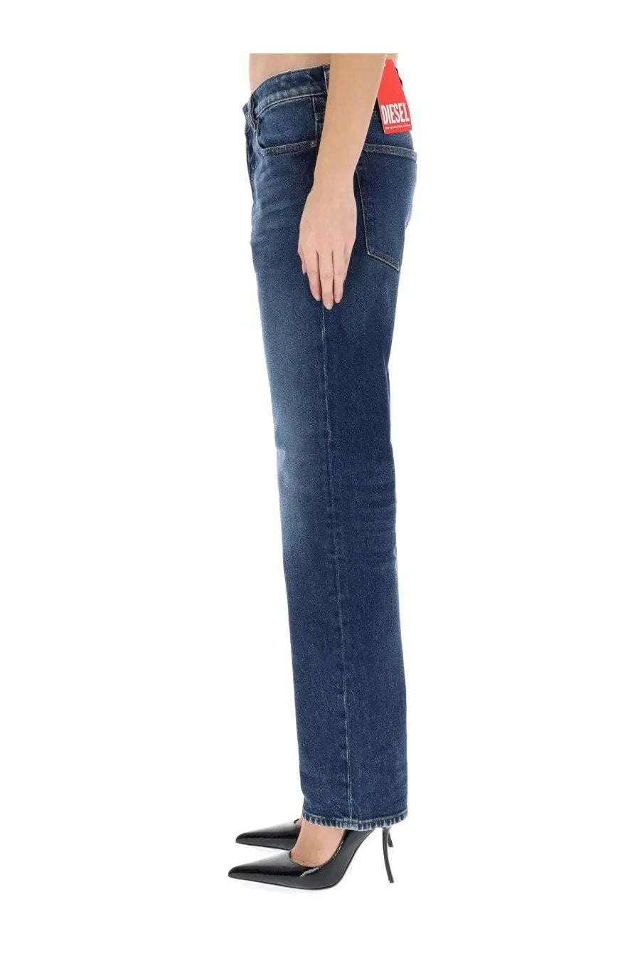 Back view of dark blue denim diesel women’s ark jeans with a red diesel brand label on the waistband