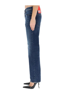 Back view of dark blue denim diesel women’s ark jeans with a red diesel brand label on the waistband