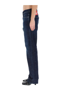 Dark blue denim diesel women’s ark jeans featuring a red diesel label at the waistband