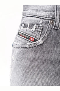 Distressed gray denim shorts with frayed pocket and black and red diesel logo patch on the back side