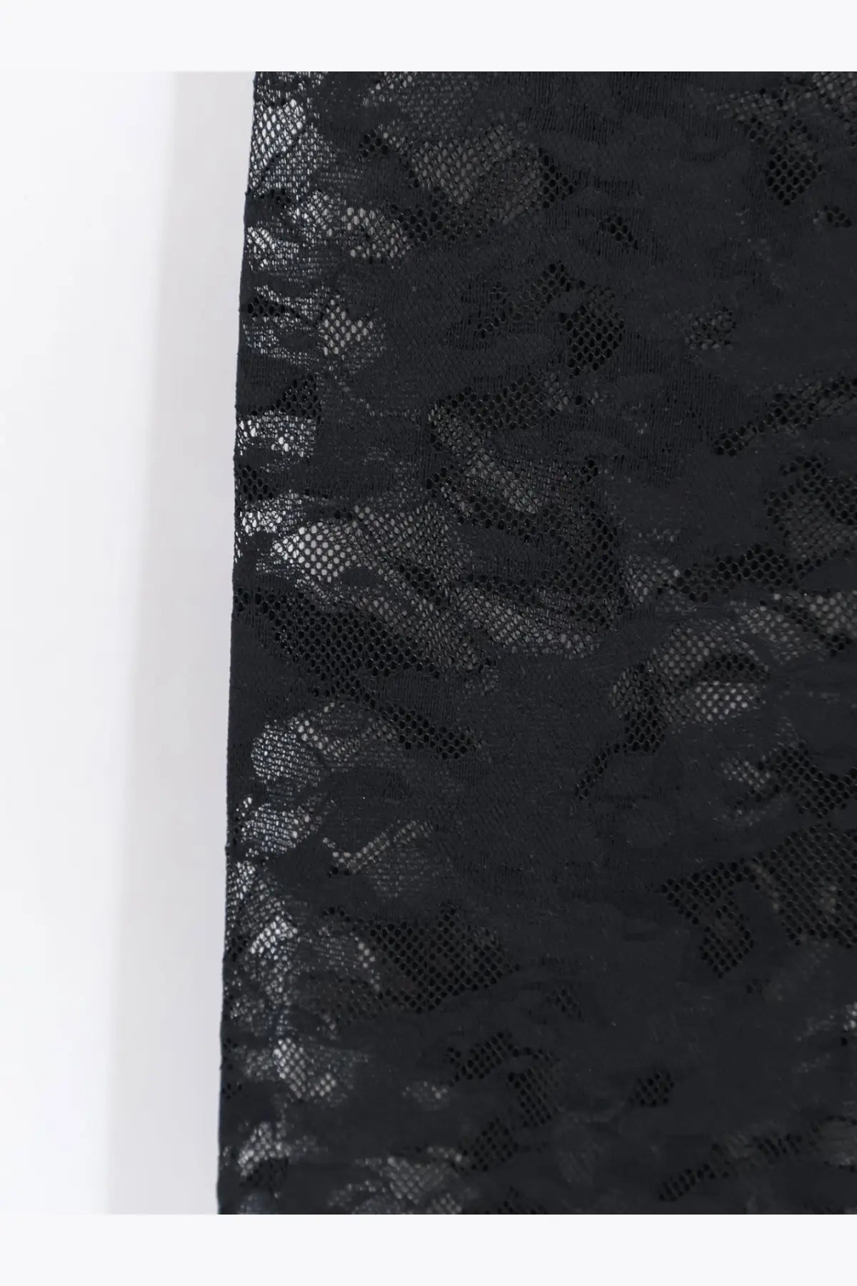 Black lace fabric with delicate floral pattern on diesel women’s claire utlt lace leggings black