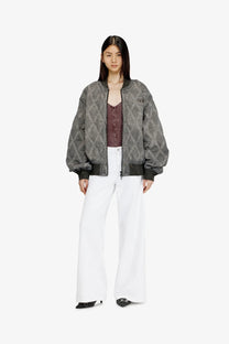 Gray quilted bomber jacket with a subtle geometric pattern and black ribbed cuffs paired with diesel women’s white cotton blend trousers
