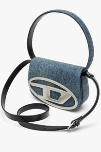 Diesel women’s denim shoulder bag in blue with denim texture silver oval logo and black leather strap