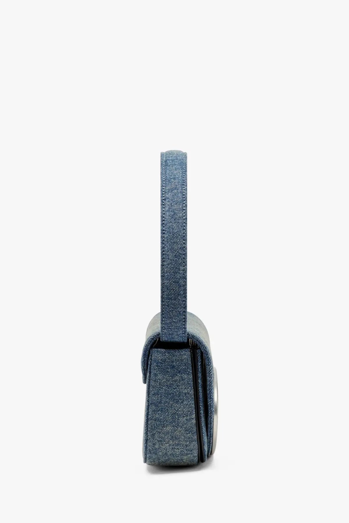 Diesel women’s denim shoulder bag in blue with denim texture, sleek minimalist design, and metallic hardware accent