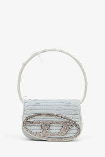 Diesel women’s light blue distressed denim shoulder bag with a silver rhinestone oval logo plaque in grey
