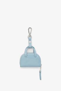 Diesel women’s dome charms pvc keychain in light blue with silver carabiner clip and matching zipper pull