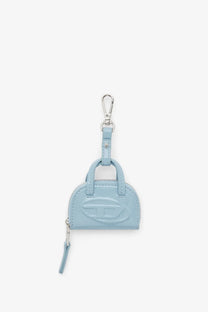 Light blue patent leather Diesel women’s dome charms pvc mini handbag keychain with silver-tone logo and zipper pull