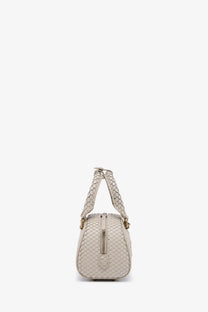 Beige woven leather diesel women’s dome python crossbody bag with structured rounded shape and gold-tone hardware