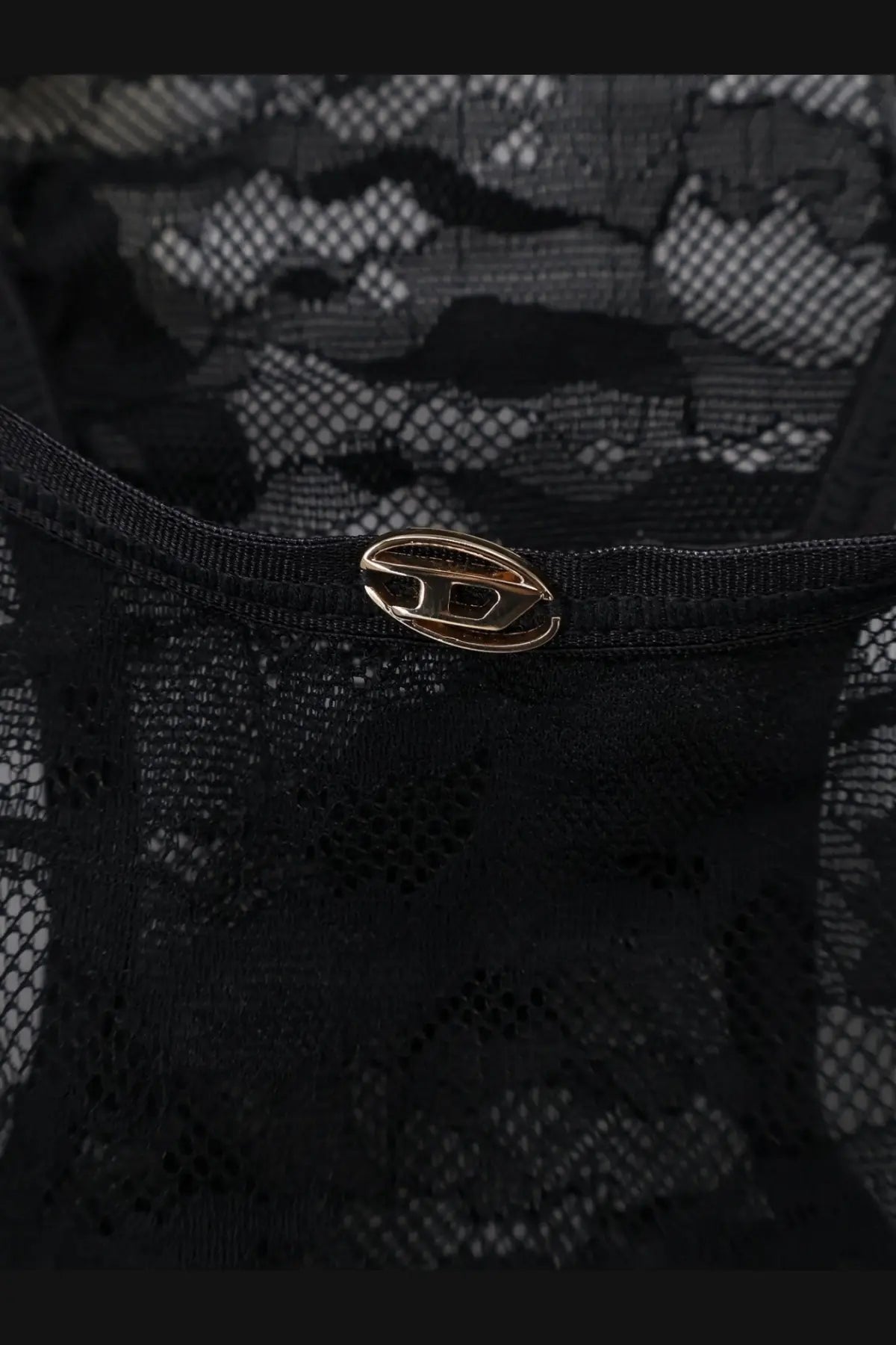 Diesel women’s ezzy lace body black featuring a sleek gold-toned oval metal clasp on intricate black lace fabric