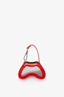 Red glossy plastic game controller shaped keychain with silver metallic clip from diesel women’s glossy play charm collection