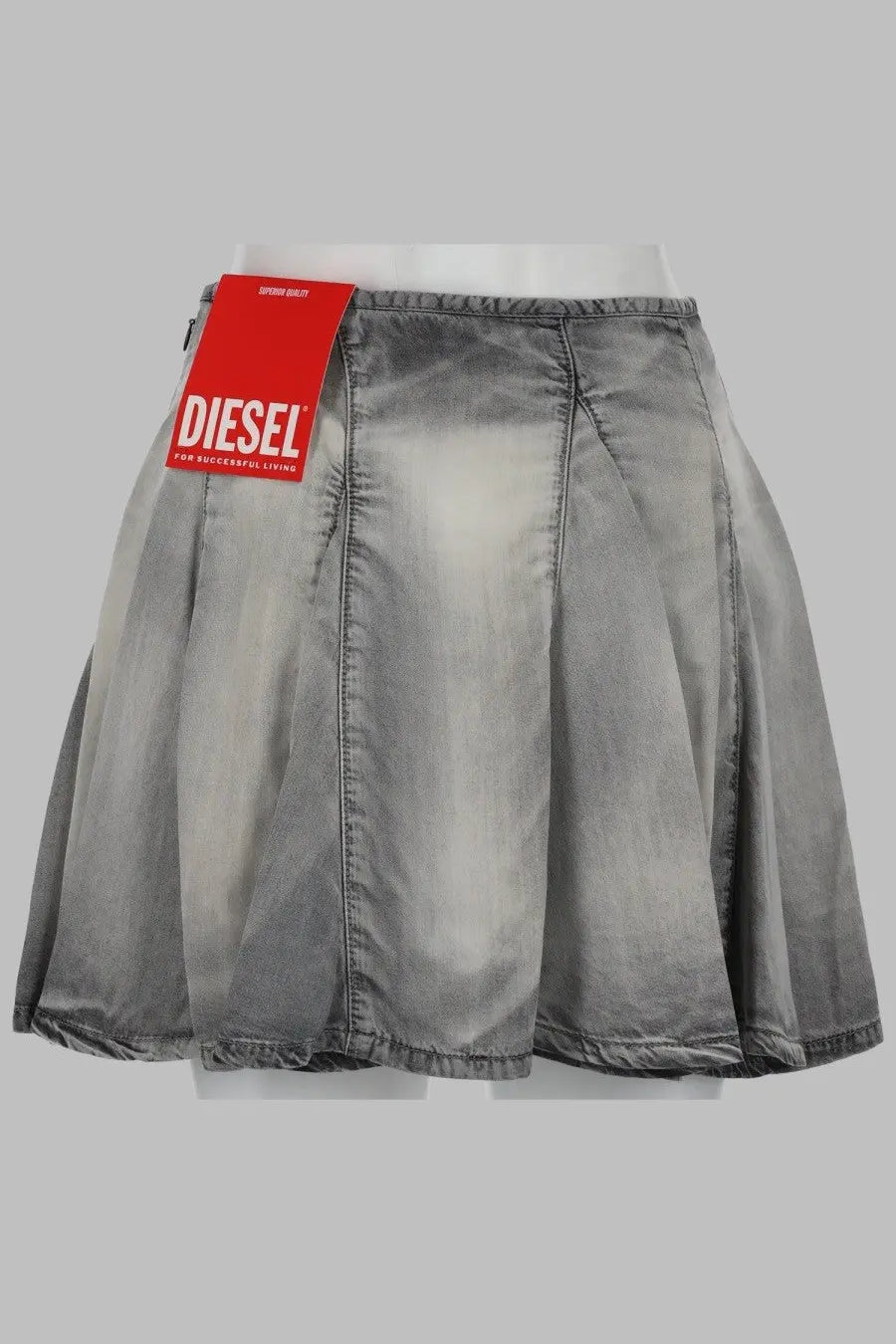 Diesel women’s gray distressed denim mini skirt with red Diesel brand tag on waistband