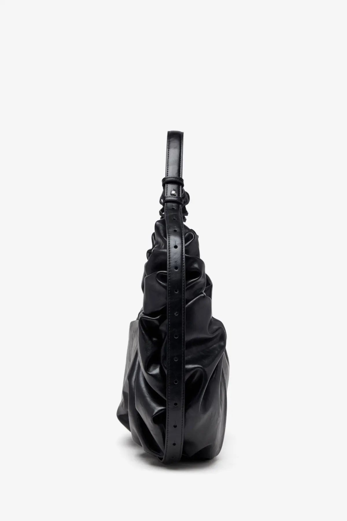Black glossy leather Diesel women’s grab hobo bag with structured ruched design and adjustable strap for crossbody use