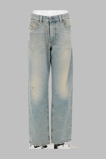 Light-wash denim Diesel women’s jeans ark blue with a distressed faded look and frayed hems front view