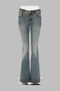 A pair of medium-wash denim flare jeans with a classic five-pocket design and subtle fading.