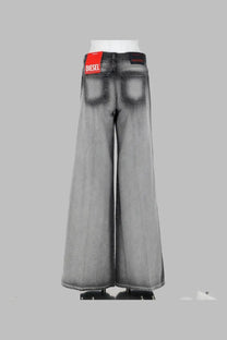 Back view of diesel women’s jeans flare akemi grey wide-leg denim pants with faded wash and red brand tag