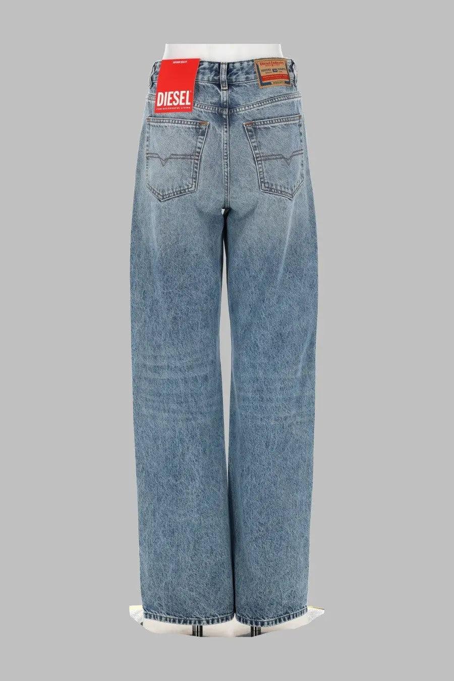 Back view of light-wash diesel women’s jeans sent blue with wide-leg cut and classic back pockets on denim material