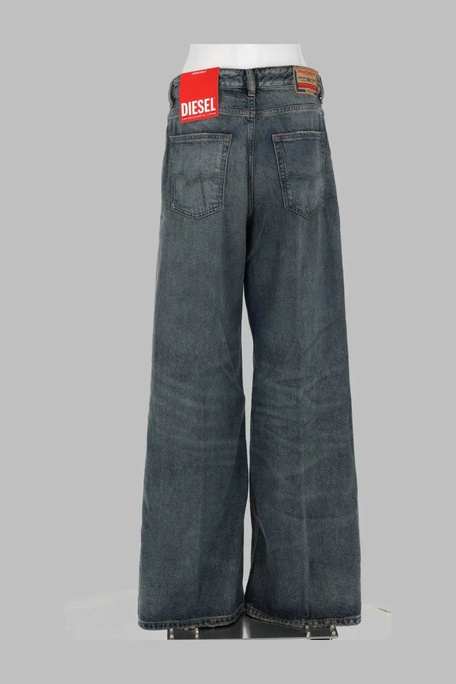 Back view of diesel women’s dark-wash wide-leg denim jeans with red diesel label on waistband in sire blue