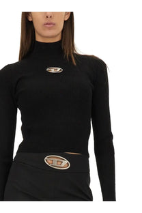 Diesel women’s black ribbed jersey turtleneck top with silver oval logo and matching belt buckle