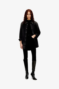 Black denim jacket with contrasting dark stitching and silver-toned buttons worn over diesel women’s mokky sl microdiv tank top