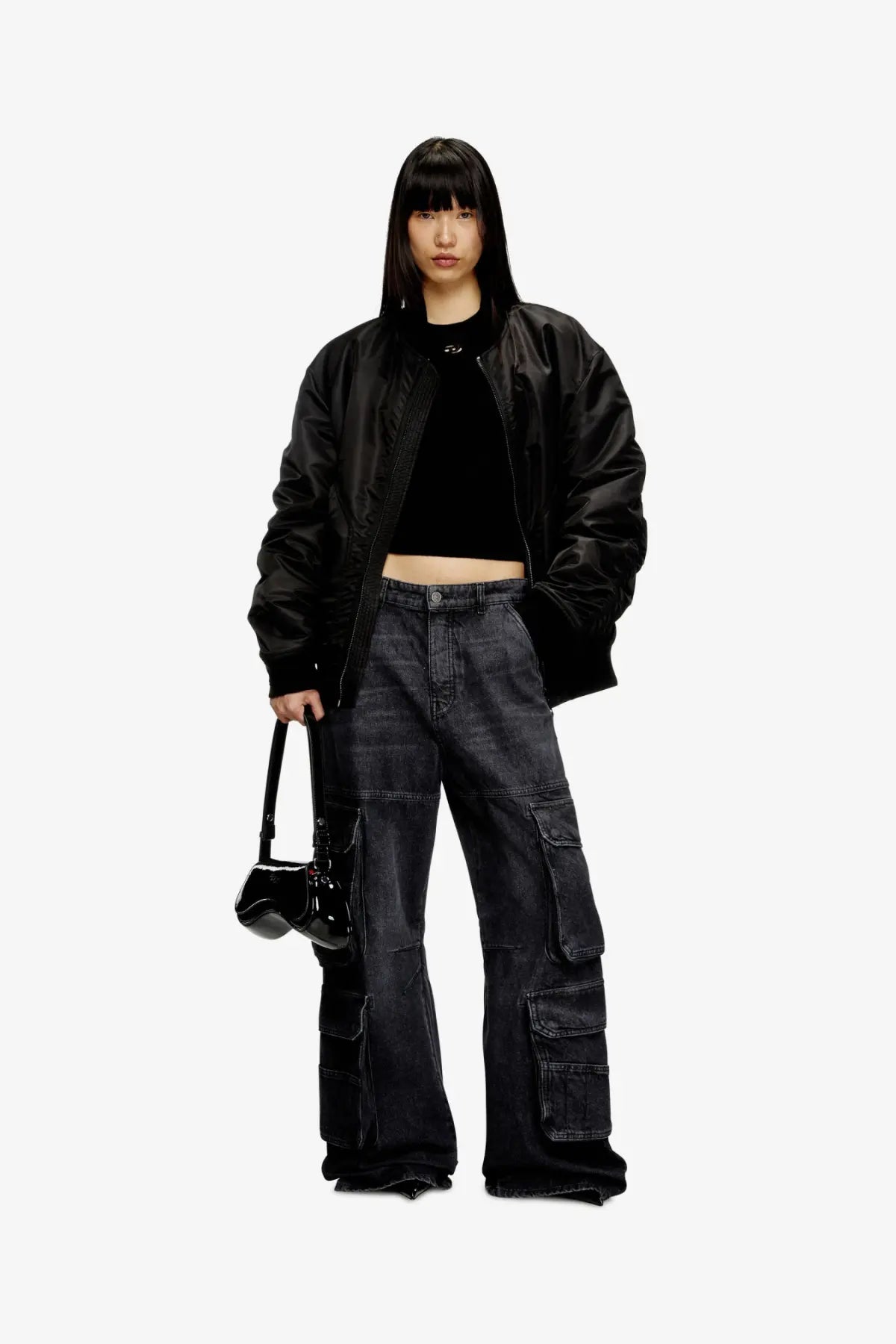 Diesel women’s play crossbody bag in black glossy patent leather with structured shape and shiny finish